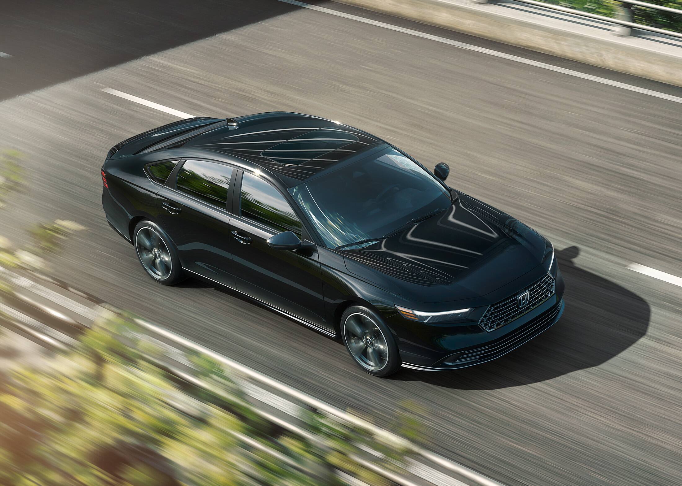 2026 Honda Accord in Crystal Black Pearl driving along overpass.