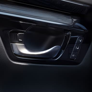 2027 Honda CR-V detail of the door handle and seat memory buttons (Compact Crossover SUV).